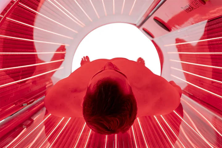 Man receiving Light Therapy in Red Light Therapy Bed